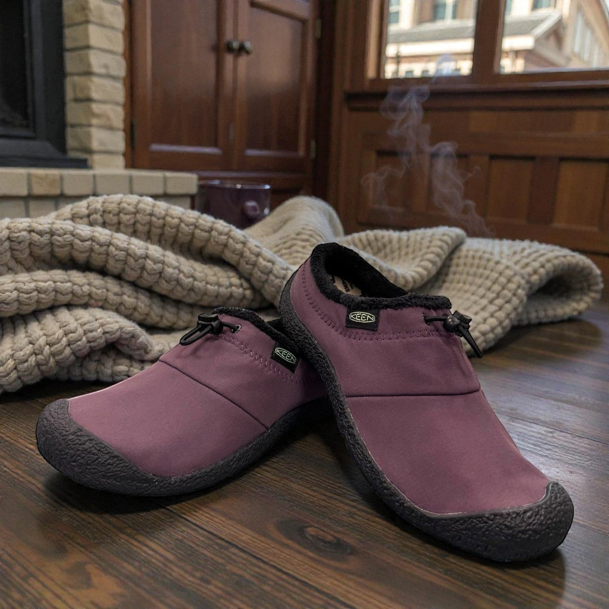 KEEN WOMEN'S HOWSER III SLIDE - Absinthe Green/Plum Perfect slip-on shoes with bungee cinch and recycled materials.