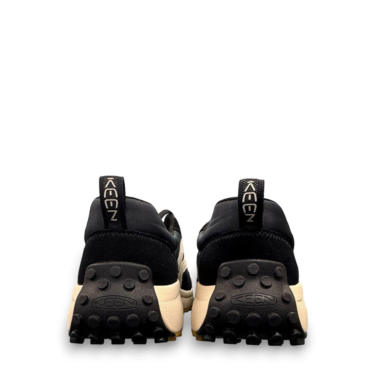 KEEN KS86 women's sneaker in black and birch leather with an aggressive trail-ready rubber outsole.