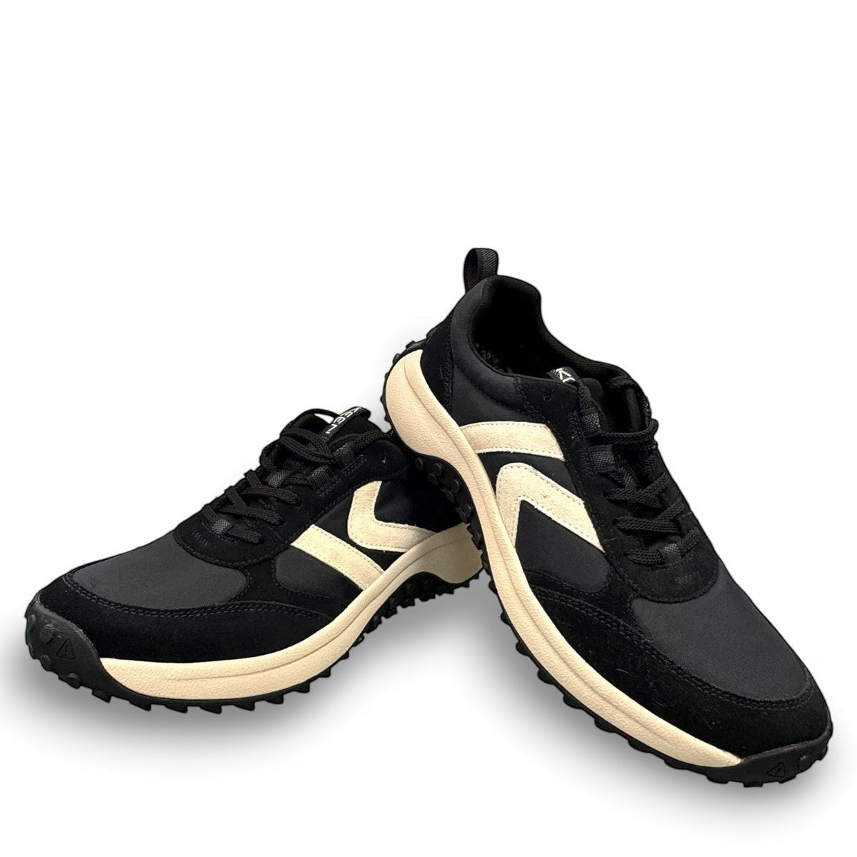 KEEN KS86 women's sneaker in black and birch leather with an aggressive trail-ready rubber outsole.