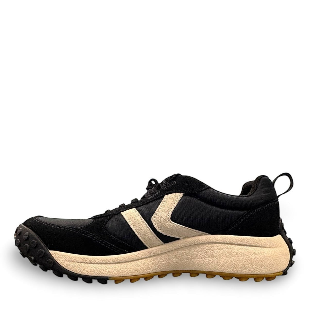 KEEN KS86 women's sneaker in black and birch leather with an aggressive trail-ready rubber outsole.