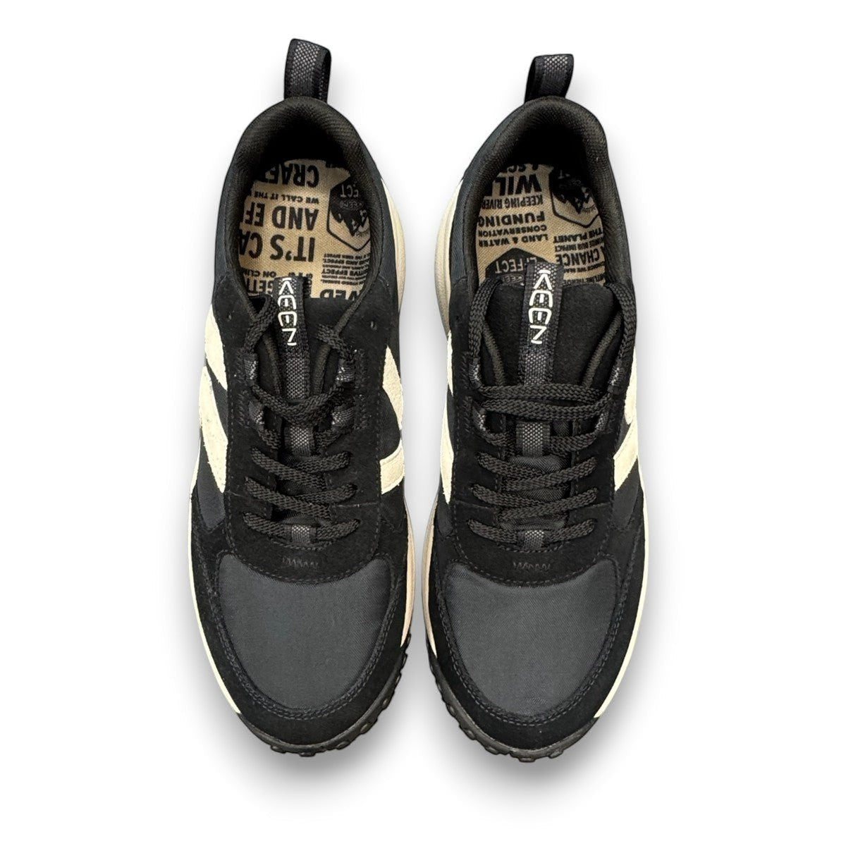 KEEN KS86 women's sneaker in black and birch leather with an aggressive trail-ready rubber outsole.