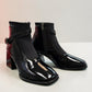 LOUJO AVERY black patent leather ankle boot with a functional side buckle and block heel