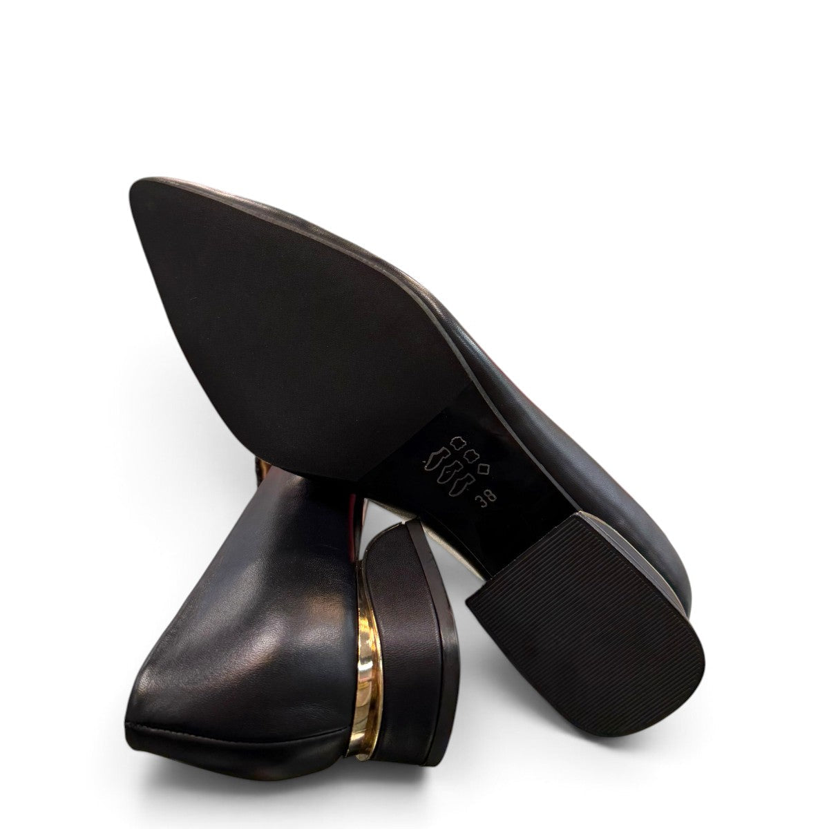 LouJo Betty black leather pump with a pointed toe, pleated detail, and a low sculpted metallic heel.