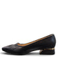 LouJo Betty black leather pump with a pointed toe, pleated detail, and a low sculpted metallic heel.