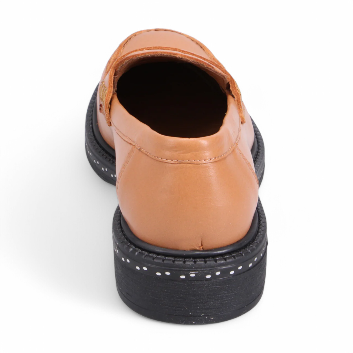 Luna Sole loafer in light tan smooth leather with a saddle strap, thick dark sole, and white speckled edge. Photo of back view.