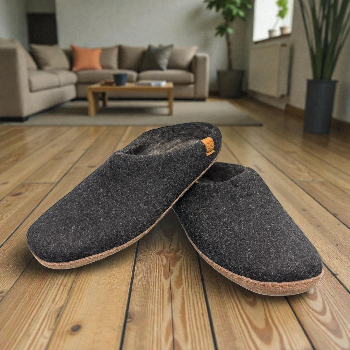 Makalu black wool slippers with EnergySole insole, handcrafted in Nepal for cozy everyday comfort.