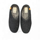 Makalu black wool slippers handcrafted in Nepal with EnergySole insoles and tan leather heel detail.