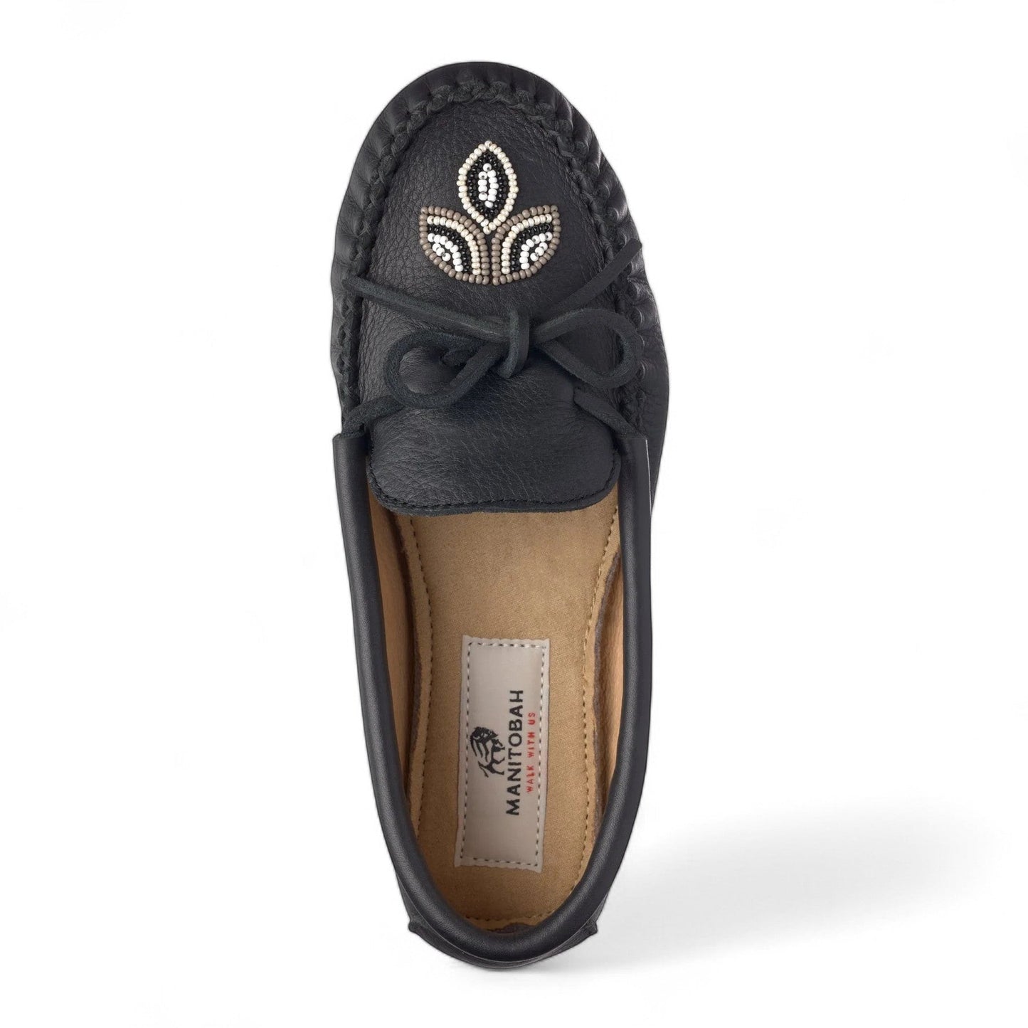 Manitobah Kayak moccasin in onyx black leather with traditional beadwork and turtle sole top view