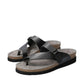 Mephisto Helen black leather sandal showing the textured black rubber outsole and cork midsole.