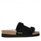 Mephisto Hemeline black sandal showing the textured rubber outsole with reflexology massage zones