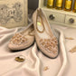 Nikpa cream synthetic ballet flat with handmade floral embellishment on the toe