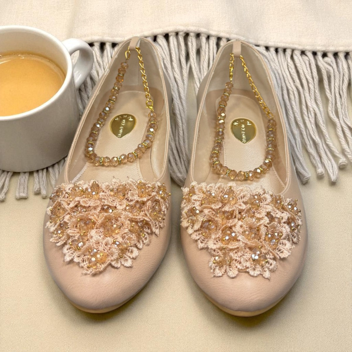 Nikpa cream synthetic ballet flat with handmade floral embellishment on the toe