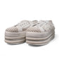 NIKPA DIBA white bridal platform sneaker with floral lace, pearl embellishments, and crystal trim.