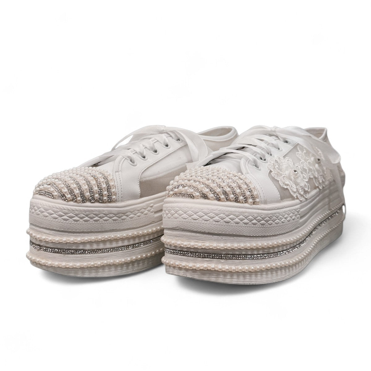 NIKPA DIBA white bridal platform sneaker with floral lace, pearl embellishments, and crystal trim.