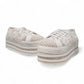NIKPA DIBA white bridal platform sneaker with floral lace, pearl embellishments, and crystal trim.