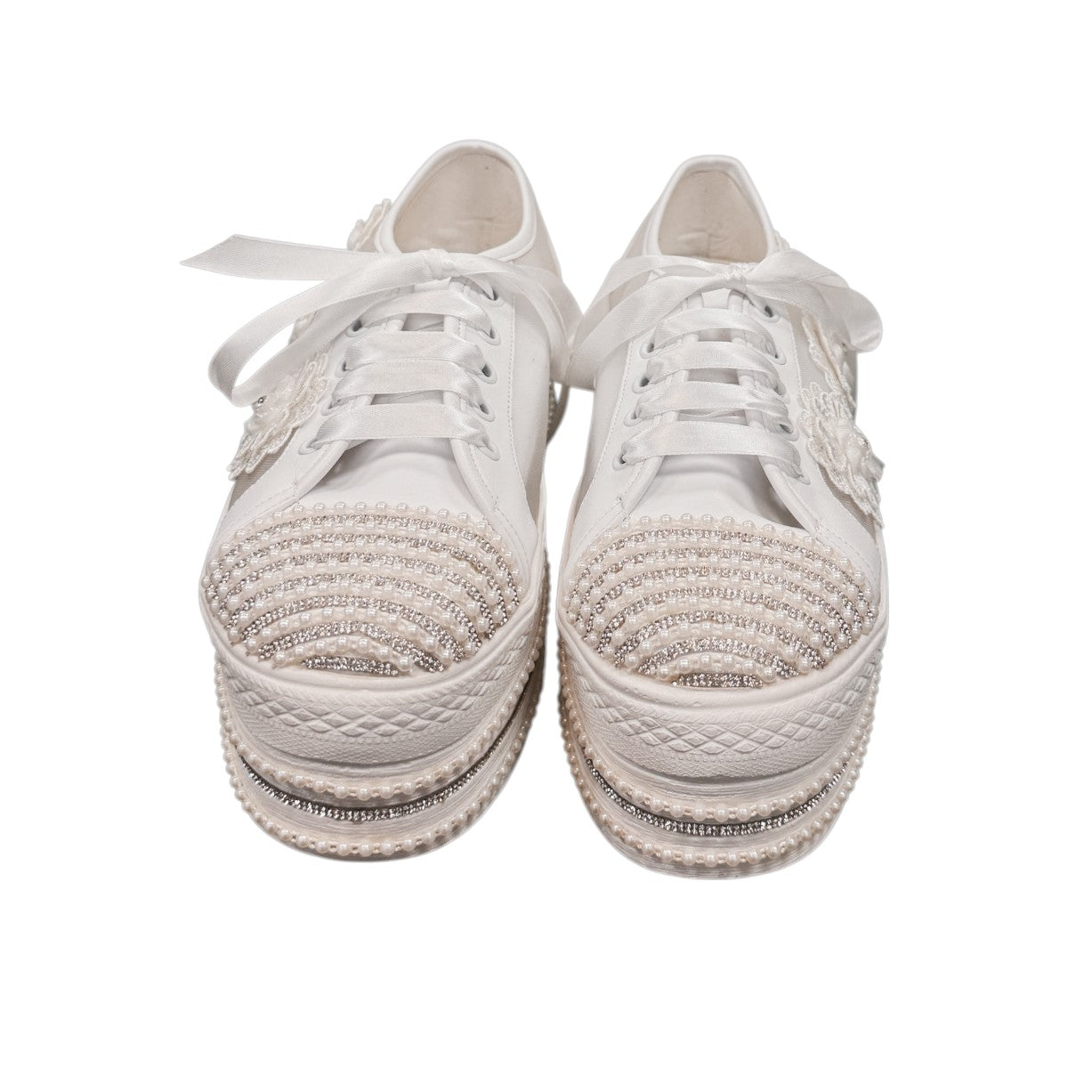 NIKPA DIBA white bridal platform sneaker with floral lace, pearl embellishments, and crystal trim.