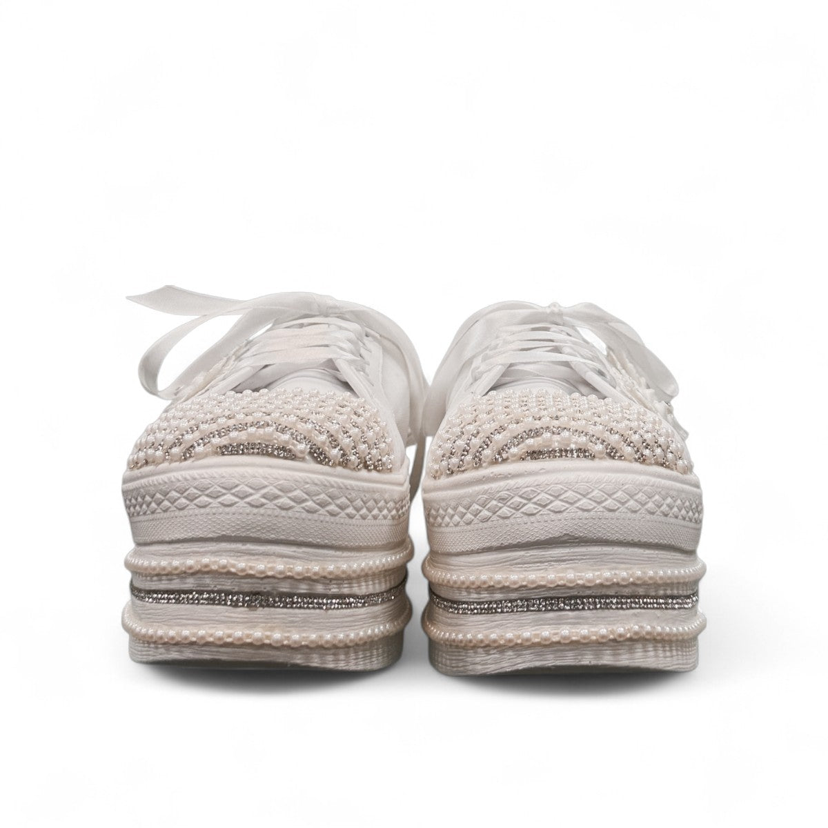 NIKPA DIBA white bridal platform sneaker with floral lace, pearl embellishments, and crystal trim.