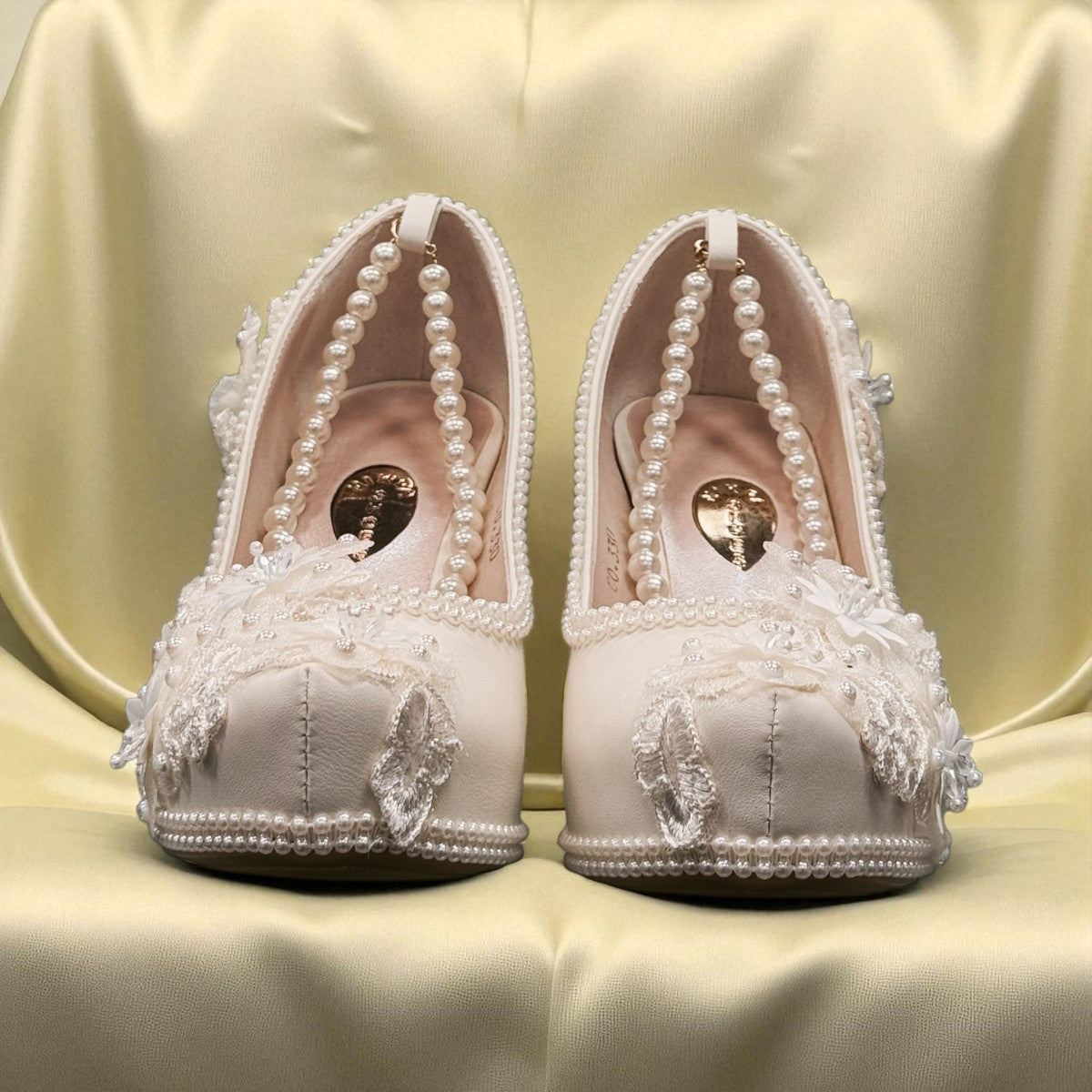 NIKPA FOXY white bridal block heel shoe with handmade floral lace, pearl embellishments, and platform.