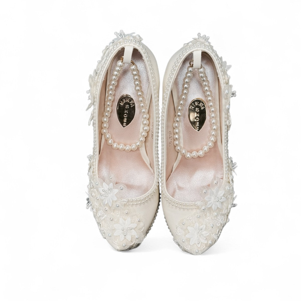 NIKPA FOXY white bridal block heel shoe with handmade floral lace, pearl embellishments, and platform.