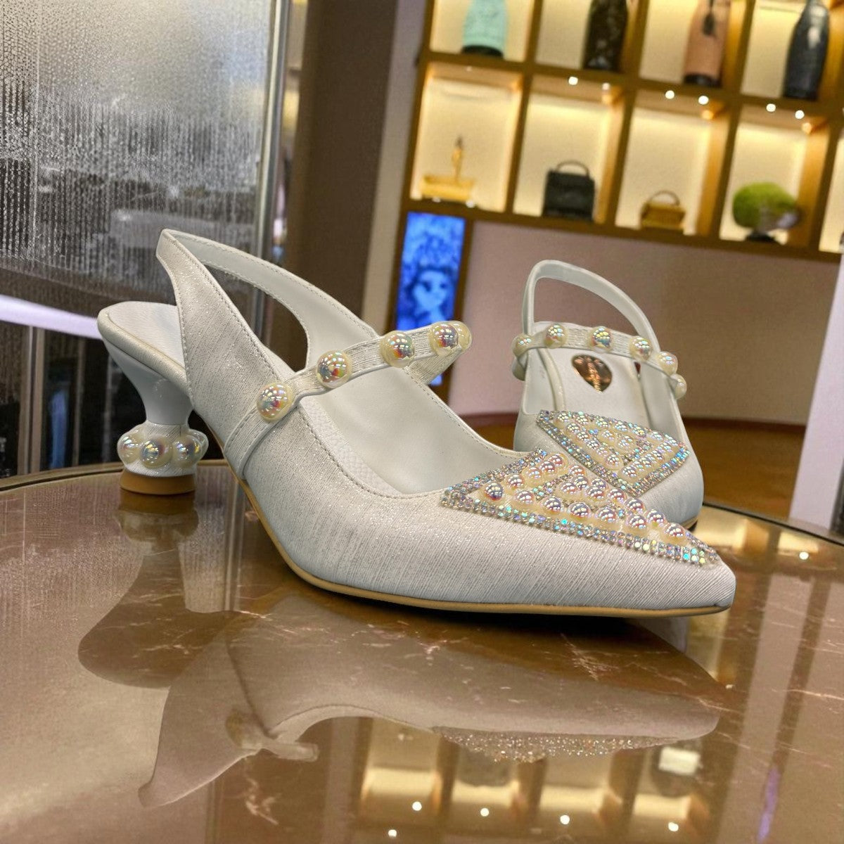 NIKPA LARA white bridal slingback heels with pearl embellishments and a unique sculptural heel