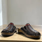 ortho-flex-S6132L black leather comfort clogs with multi-tone strap details, contrast stitching, and a low wedge sole.
photo of the front side