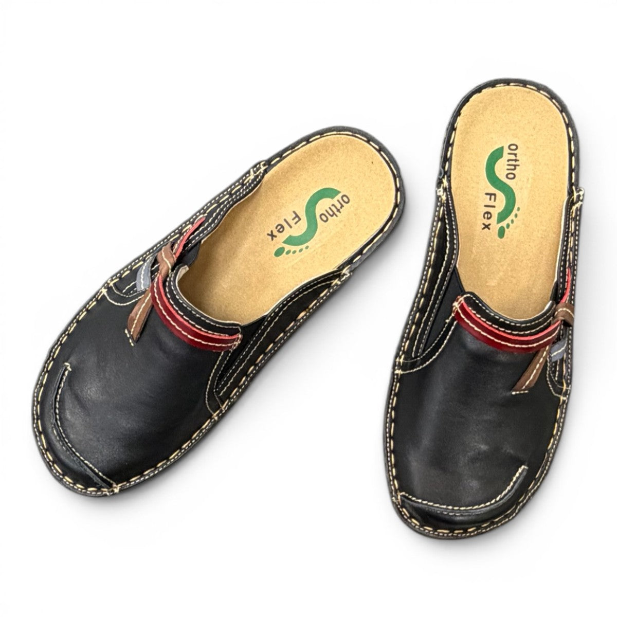 ortho-flex-S6132L black leather comfort clogs with multi-tone strap details, contrast stitching, and a low wedge sole.
photo of the top side