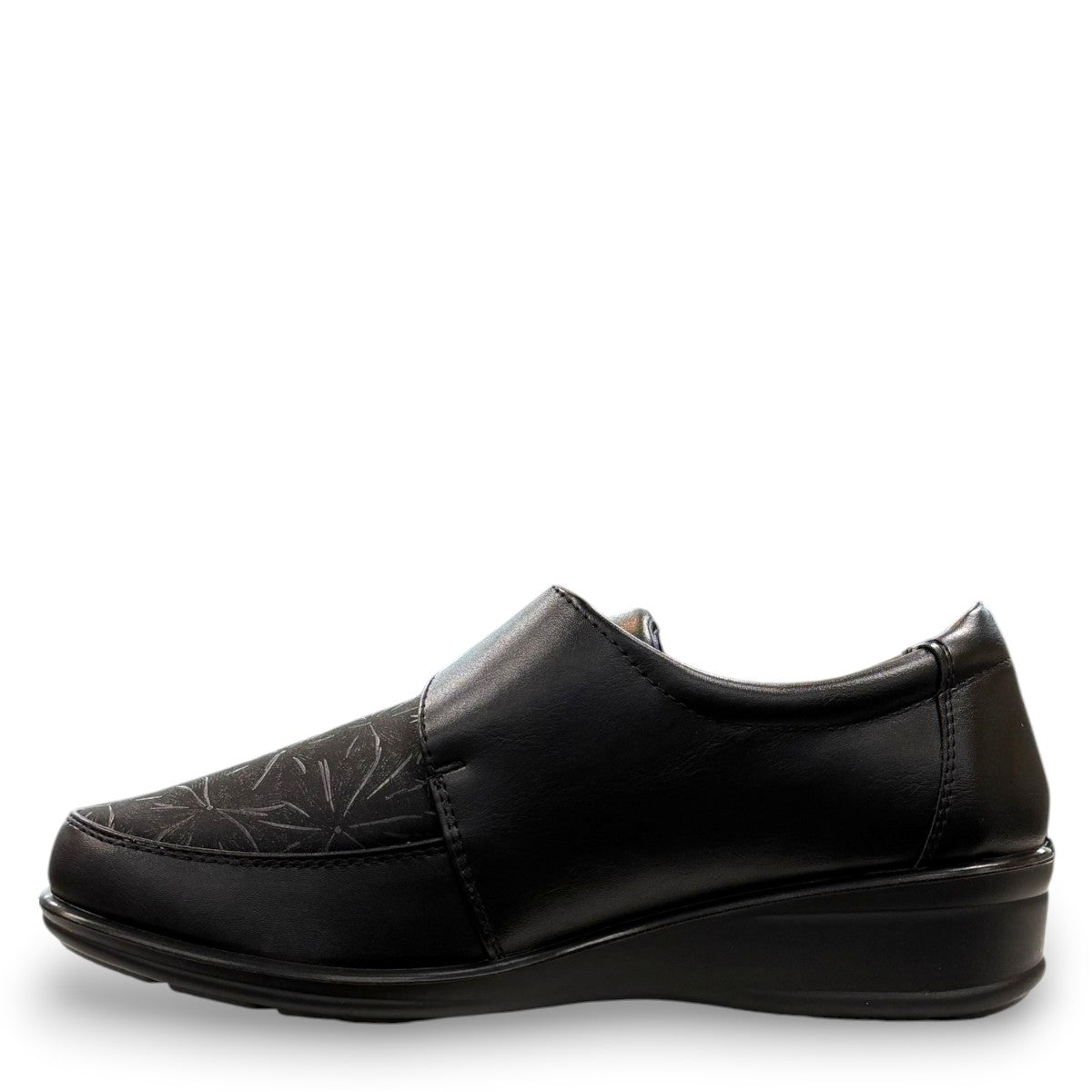 ORTHO FLEX F8244 black comfort shoe with adjustable strap, textured accents, and cushioned sole.
photo of the left side