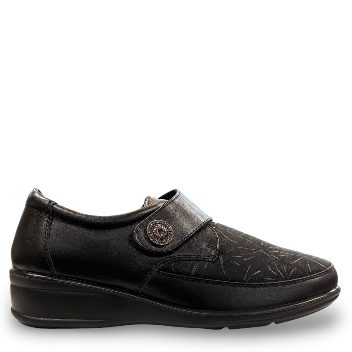 ORTHO FLEX F8244 black comfort shoe with adjustable strap, textured accents, and cushioned sole.
photo of the right side