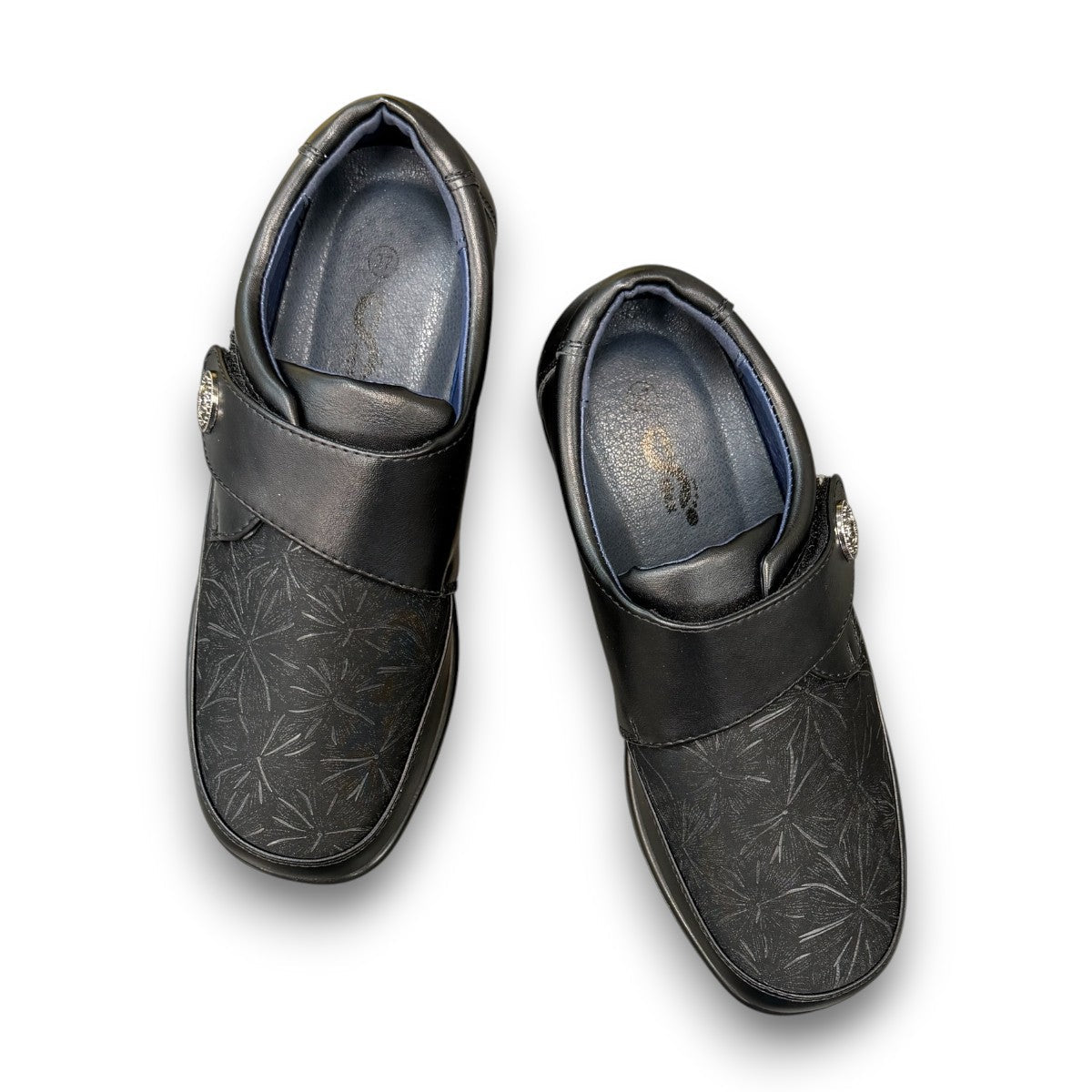 ORTHO FLEX F8244 black comfort shoe with adjustable strap, textured accents, and cushioned sole.
photo of the top side