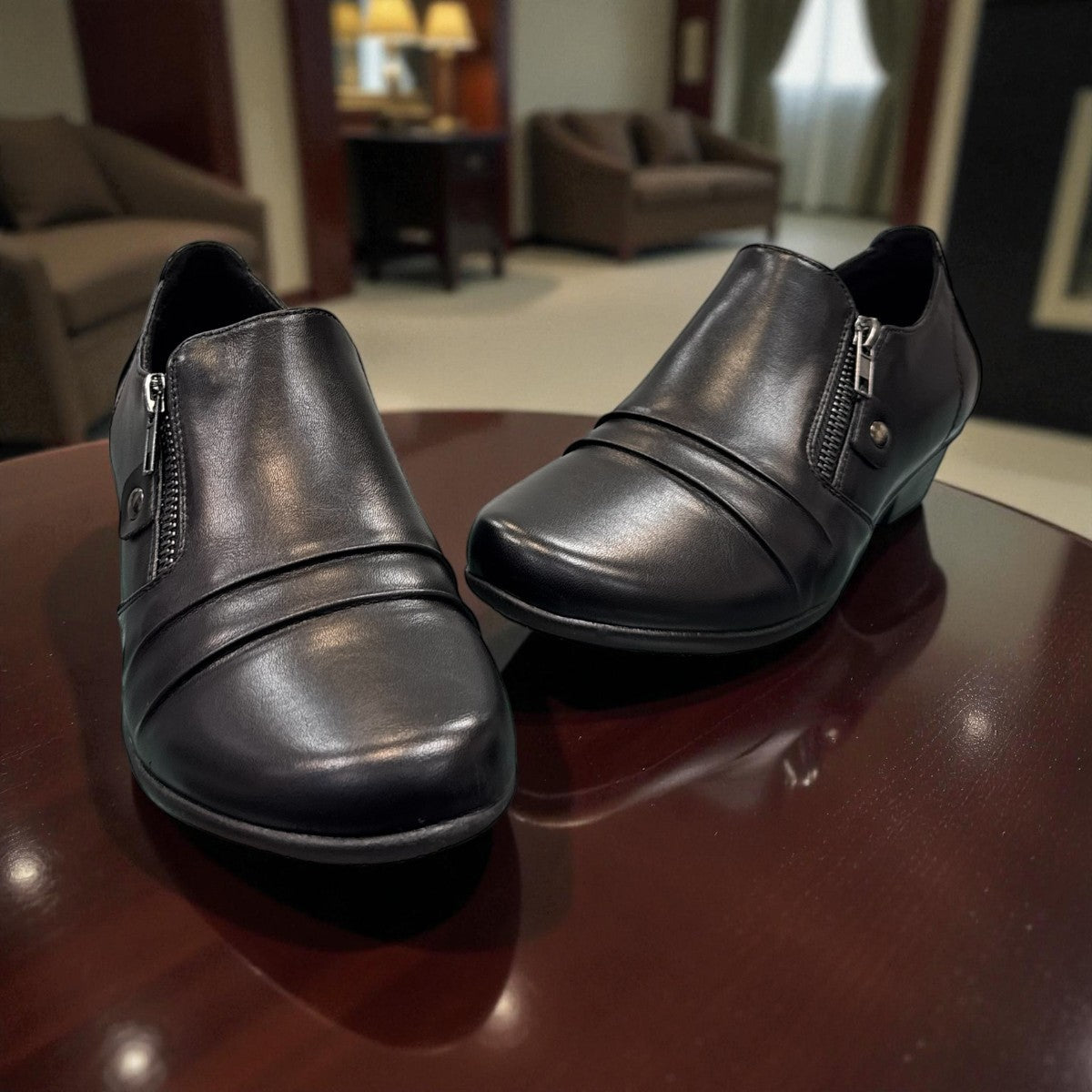 Ortho Flex black low-cut dress shoe with side zipper detail and a short block heel.
photo of the front side