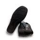ORTHO FLEX F8244 black comfort shoe with adjustable strap, textured accents, and cushioned sole.
photo of the bottom side