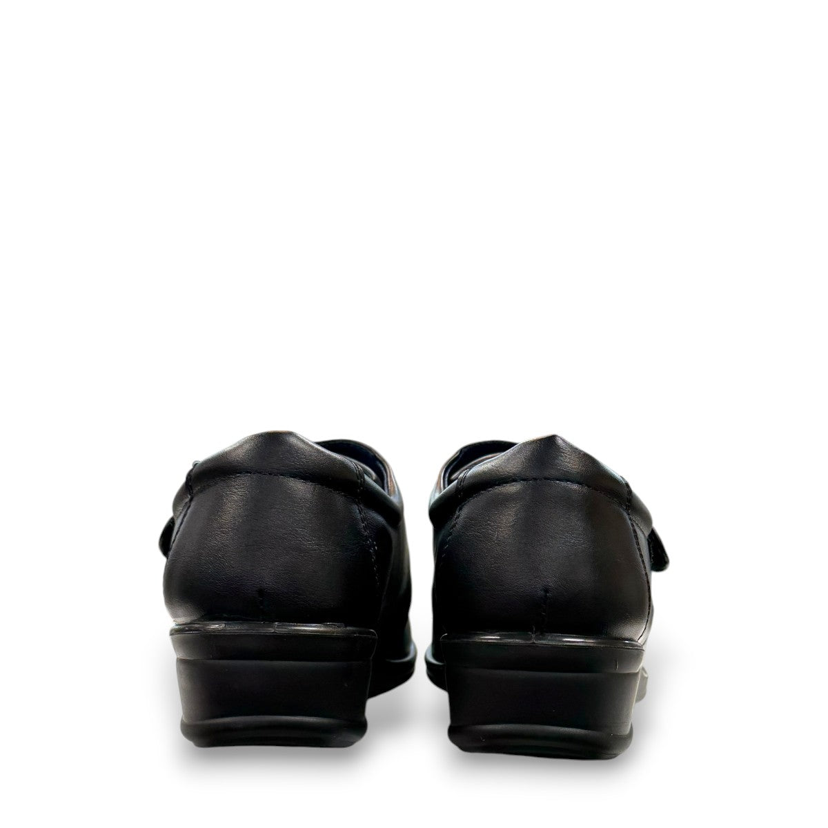 ORTHO FLEX F8244 black comfort shoe with adjustable strap, textured accents, and cushioned sole.
photo of the back side