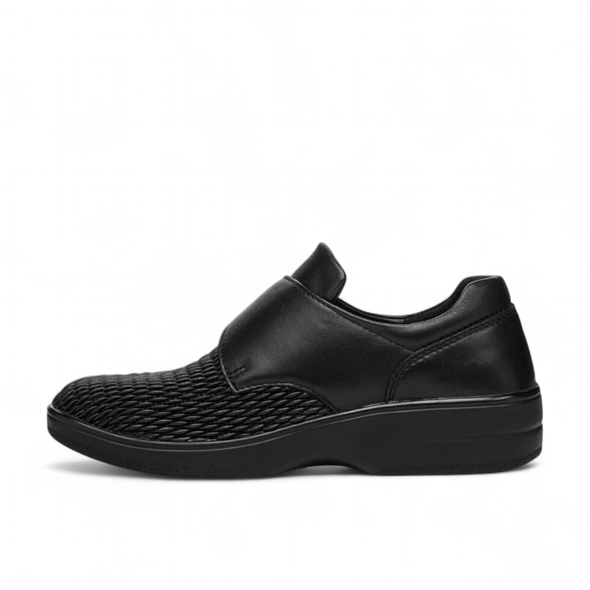Propet Bianca black leather orthotic shoe with a single hook and loop strap and textured toe detail.
photo of the left side