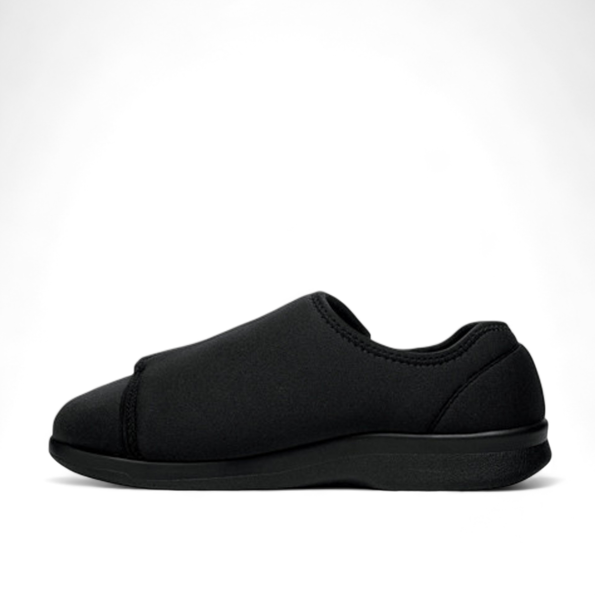 Propet Cush N Foot black stretchable slipper with adjustable strap for swollen feet and bunions.
photo of the left side