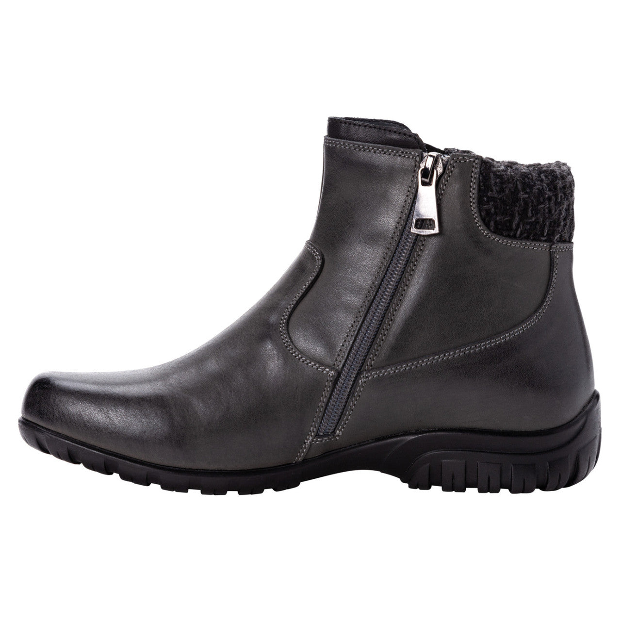 Propet Darley black leather ankle bootie with twin zips, knit collar, and rubber outsole.
photo of the left side