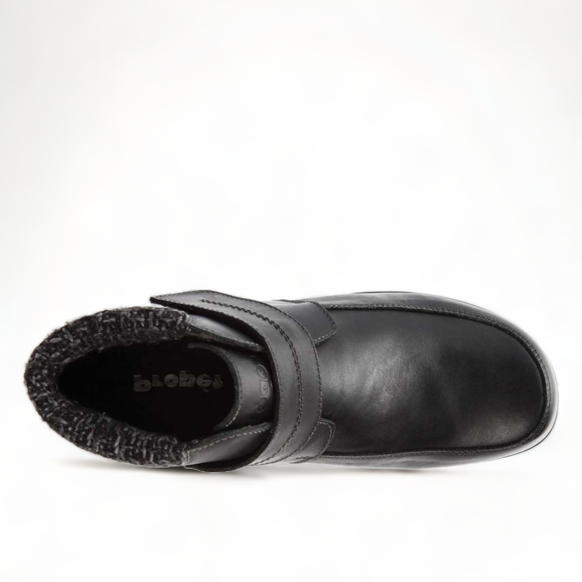 Propet Delaney black leather ankle boot with adjustable strap closure and grey knit collar.
photo of the top side