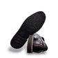 Propet Flynn black leather slip-on shoe with twin gore panels and a durable rubber outsole.
photo of the bottom side