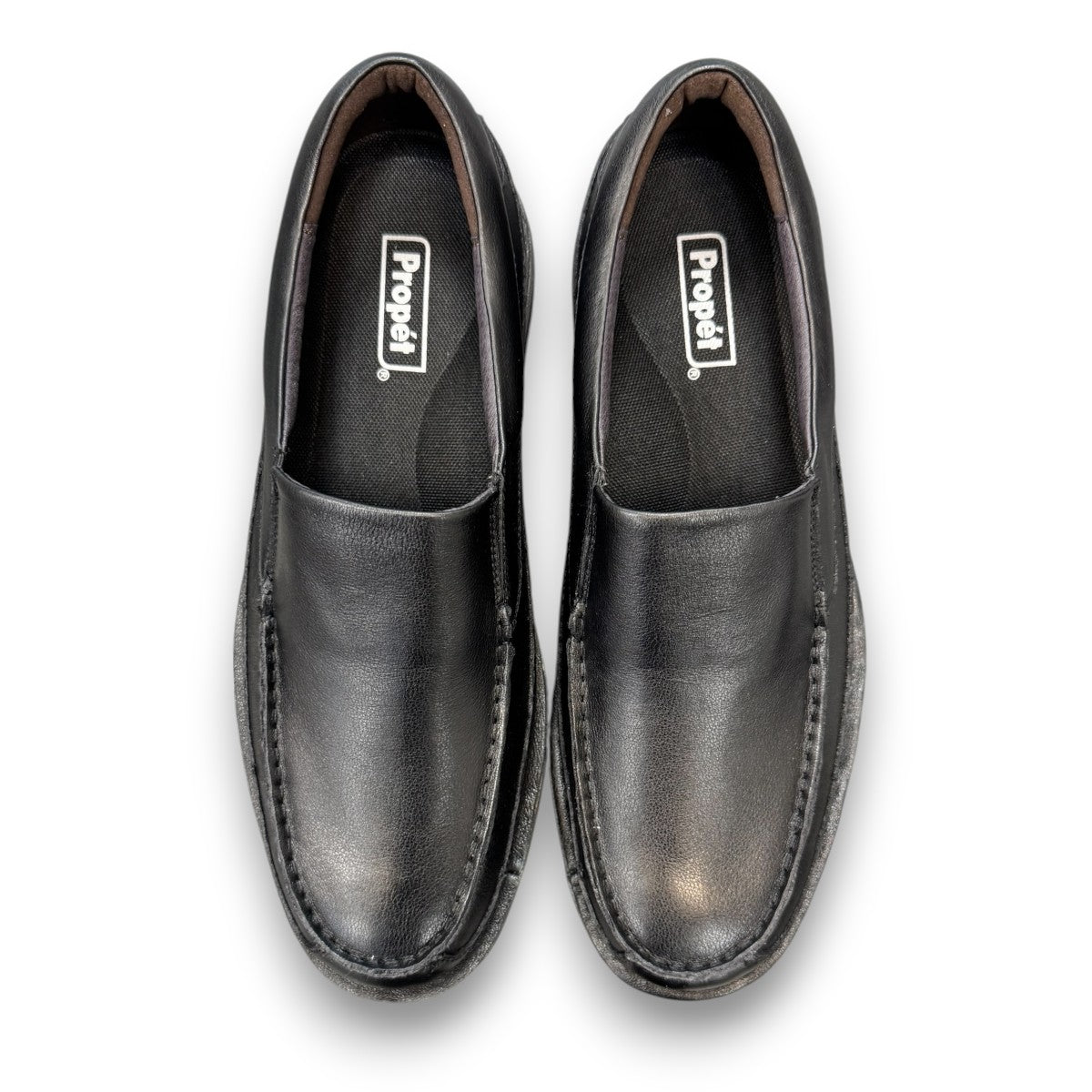 Propet Flynn black leather slip-on shoe with twin gore panels and a durable rubber outsole.
photo of the top side