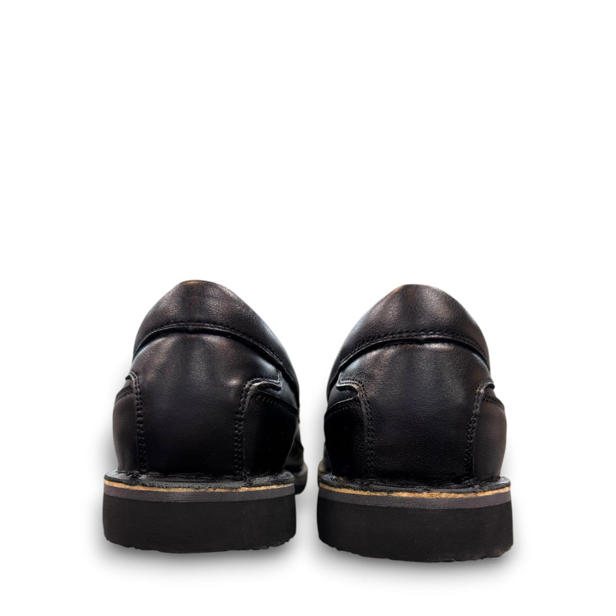 Propet Flynn black leather slip-on shoe with twin gore panels and a durable rubber outsole.
photo of the back side