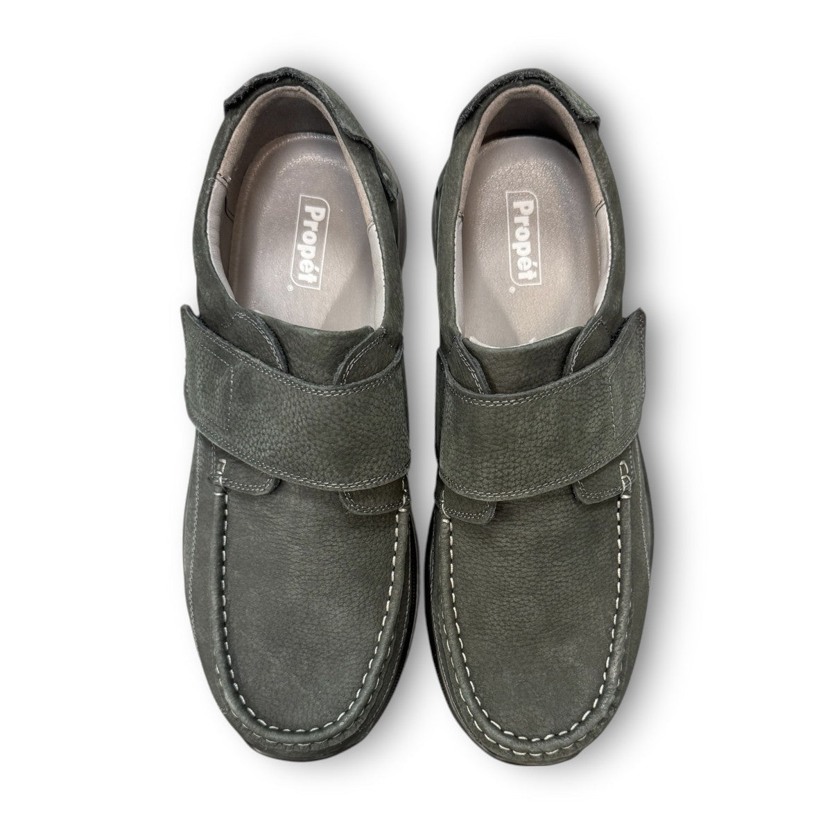 Propet Pomeroy navy suede boat shoe with lace closure, contrast stitching, and cushioned EVA midsole.
photo of the top side