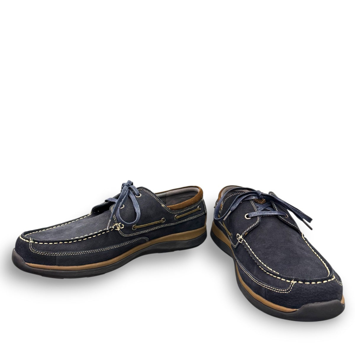 Propet Pomeroy navy suede boat shoe with lace closure, contrast stitching, and cushioned EVA midsole.
photo of the  front side