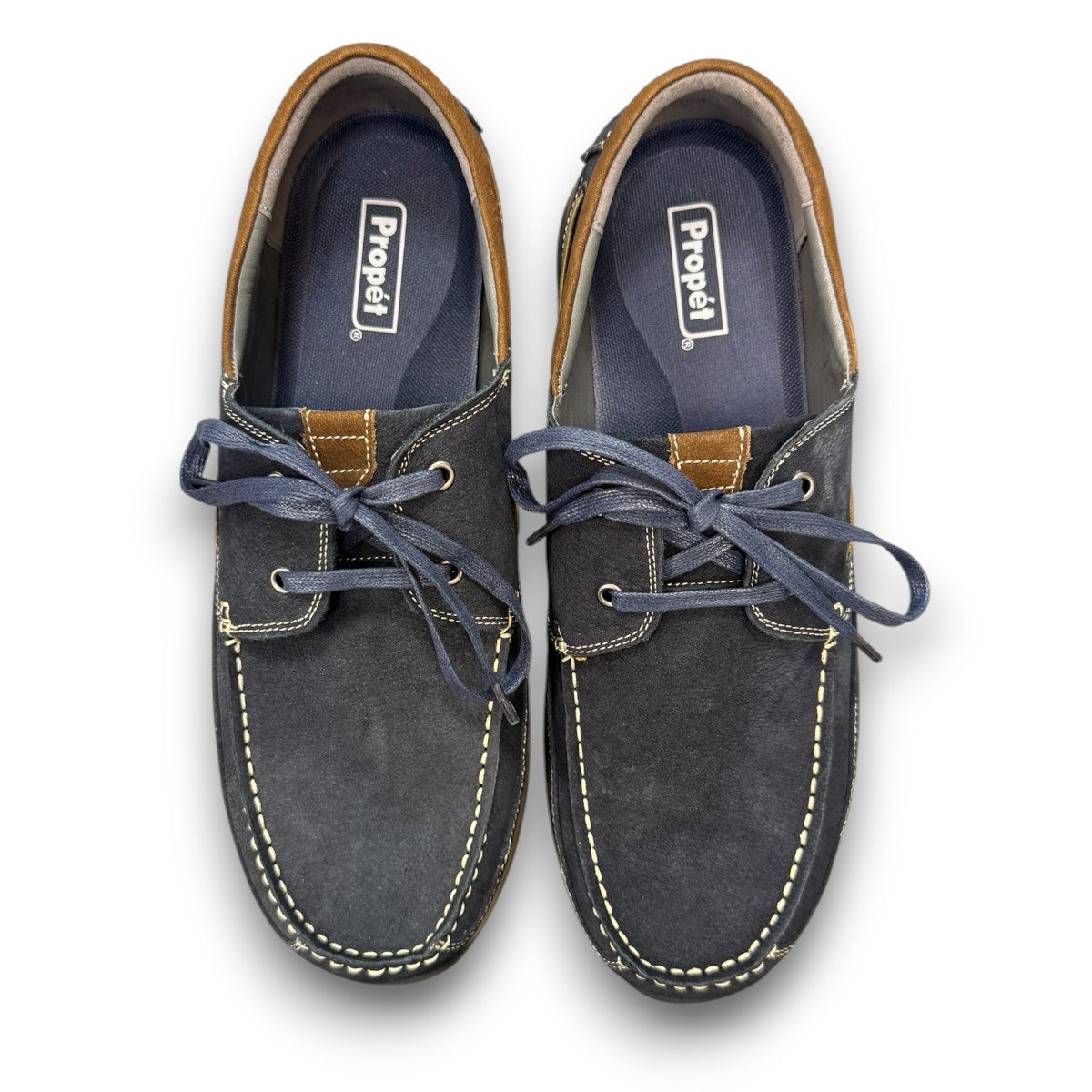 Propet Pomeroy navy suede boat shoe with lace closure, contrast stitching, and cushioned EVA midsole.
photo of the  top side