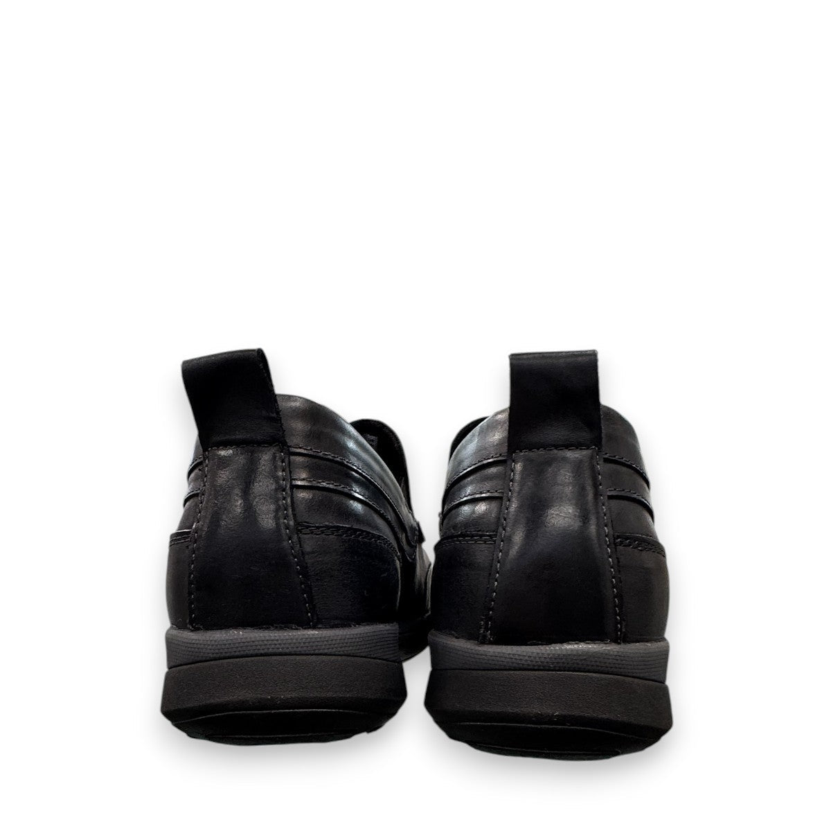Propet Preston black leather slip-on boat shoe with twin gores and a flexible EVA outsole.
photo of the back side
