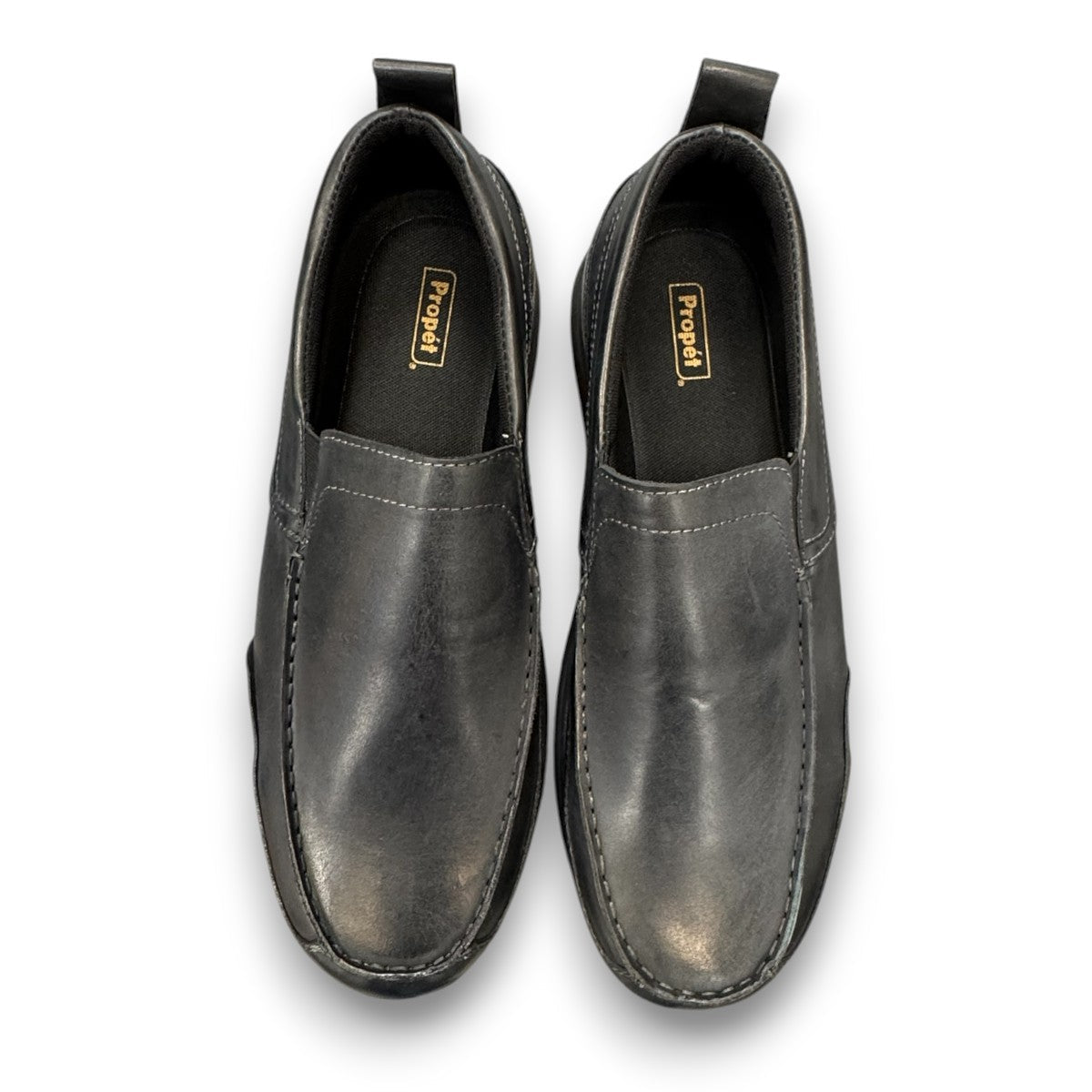 Propet Preston black leather slip-on boat shoe with twin gores and a flexible EVA outsole.
photo of the top side