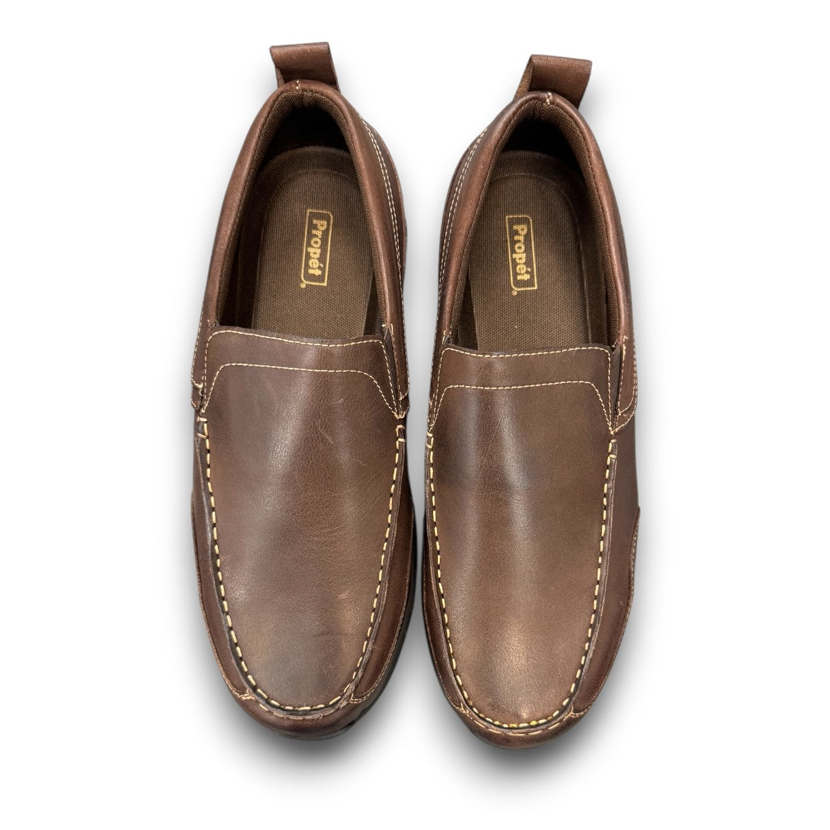 Propet Preston coffee brown leather slip-on boat shoe with twin gore detailing and flexible EVA outsole.
photo of the top side