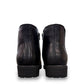 Propet Truman black leather Chelsea boot with elastic side panel and durable lugged TPR outsole.
photo of the back side
