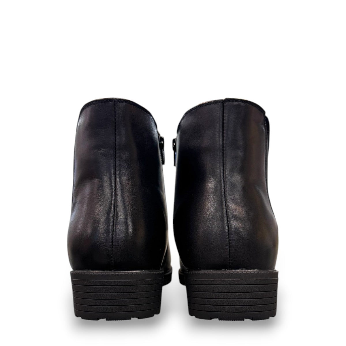 Propet Truman black leather Chelsea boot with elastic side panel and durable lugged TPR outsole.
photo of the back side