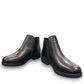 Propet Truman black leather Chelsea boot with elastic side panel and durable lugged TPR outsole.
photo of the front side