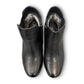Propet Truman black leather Chelsea boot with elastic side panel and durable lugged TPR outsole.
photo of the top side