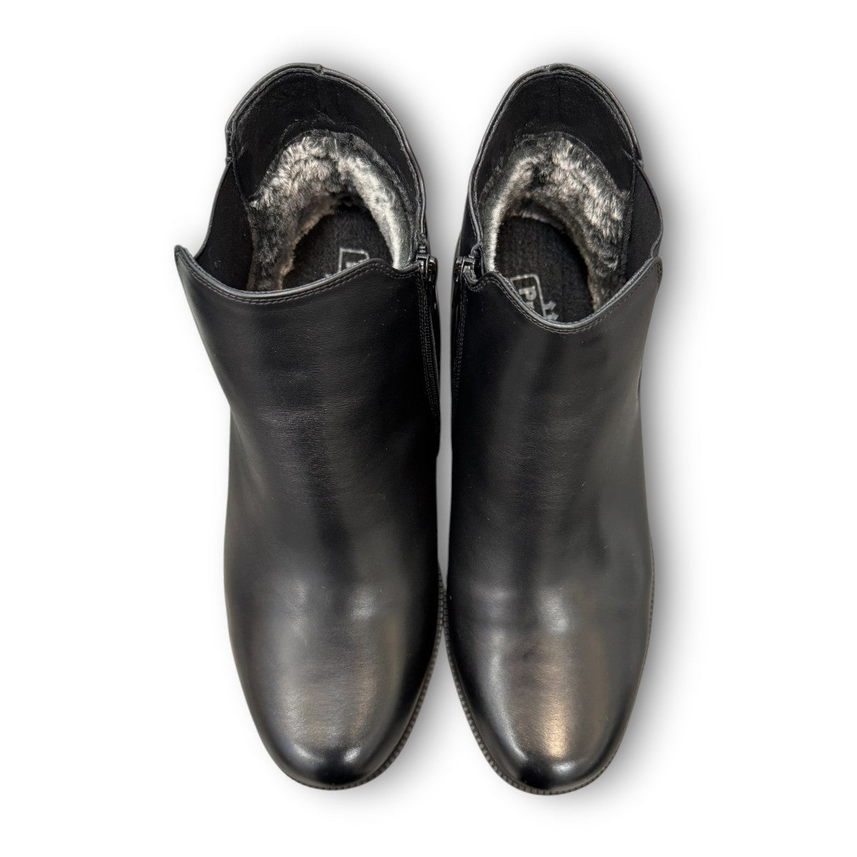 Propet Truman black leather Chelsea boot with elastic side panel and durable lugged TPR outsole.
photo of the top side